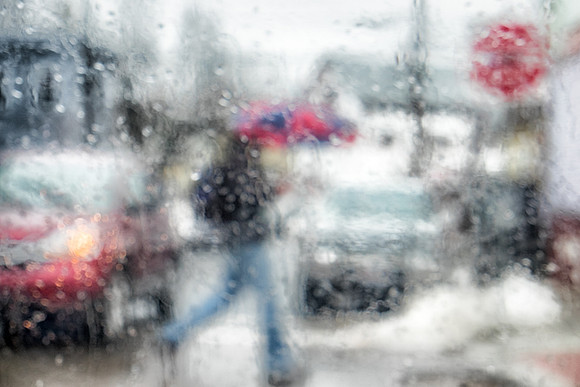 Man with Umbrella Crossing Street