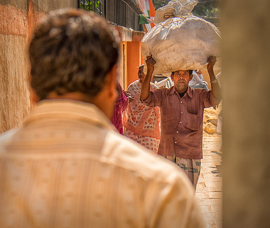 Man in Alley with Bundle